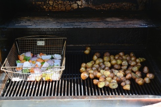The potatoes are coming along nicely. They're almost ready to transfer to the indirect side of the grill.
